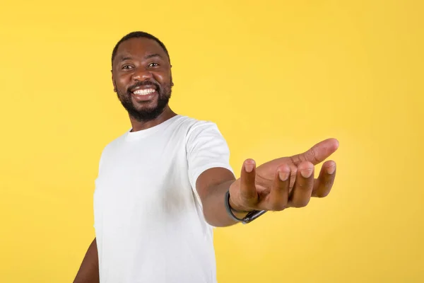 Look Happy Black Man Showing Invisible Object Holding Hand Smiling — Stockfoto