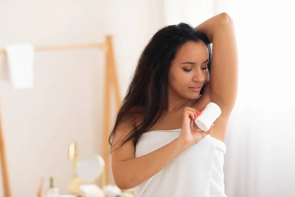 Attractive Woman Applying Antiperspirant Stick Armpit Sweat Protection Standing Modern — Stockfoto