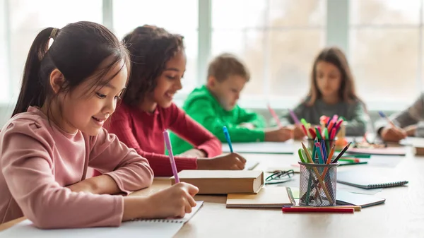 Japanese Schoolgirl Taking Notes Writing Essay Learning Modern Classroom School — 图库照片