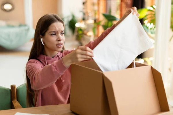 Delivery Shopping Problems Discontented Teenage Girl Unpacking Box New Clothes — Stockfoto