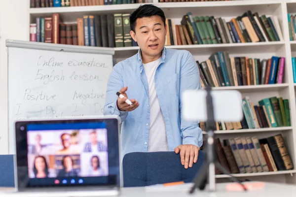 Online Learning Asian Tutor Male Talking Laptop Cellphone Making Video — ストック写真
