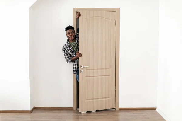 Joyful African American Guy Posing Opened Door His Apartment Male — Stockfoto