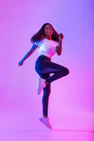 Joyful Millennial African American Woman Flying Air Jumping Smiling Camera — Stock fotografie