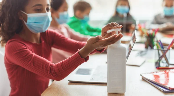 Coronavirus Protection Black Schoolgirl Applying Sanitizer Disinfecting Hands Sitting Diverse — Stock Fotó