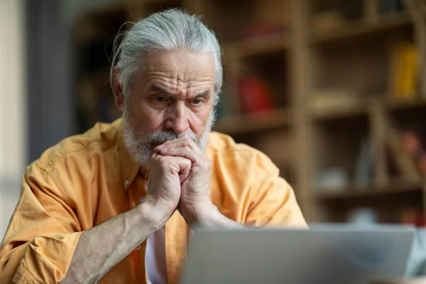 Concentrated Grey Haired Senior Man Pensioner Sitting Front Laptop Home — Fotografia de Stock