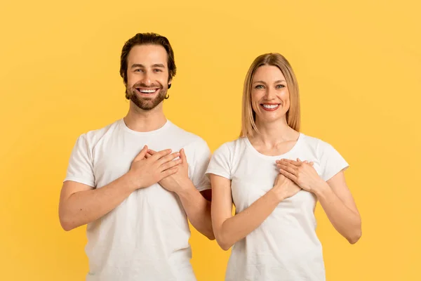 Smiling Millennial Caucasian Family White Shirts Press Hands Chest Isolated — Stockfoto
