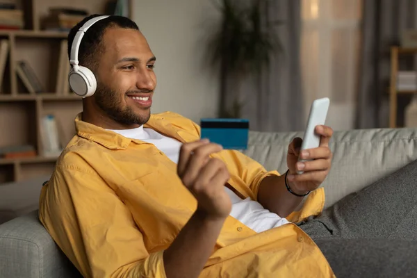 Remote Payment Online Order Concept Happy Young Black Man Headphones — 스톡 사진