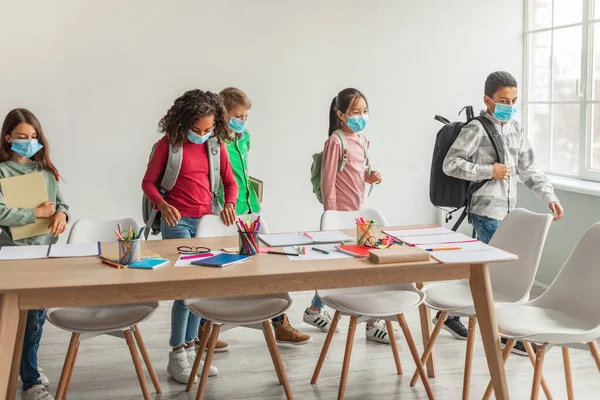 Diverse School Kids Backpacks Wearing Face Masks Entering Modern Classroom — стоковое фото