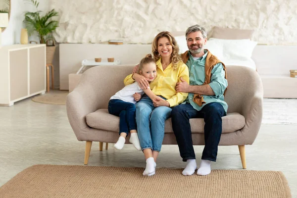 Cheerful Family Three Sitting Couch Modern Living Room Indoor Happy — ストック写真