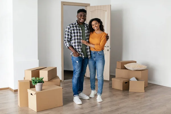 New Home Happy African American Spouses Hugging Posing Cardboard Boxes — Stok fotoğraf