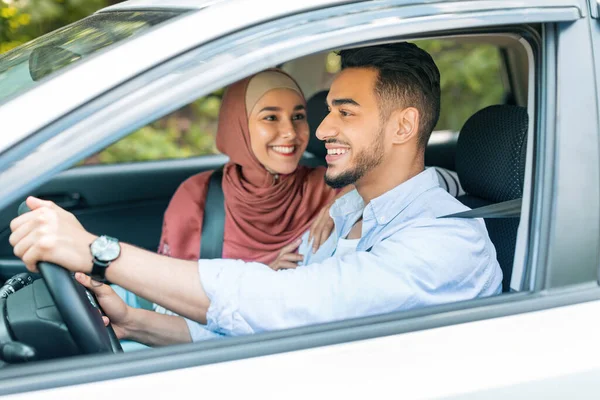 Smiling Excited Millennial Middle Eastern Woman Hijab Looks Male Steering — Stockfoto