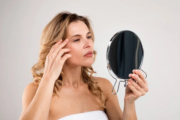 Skin Aging Attractive Middle Aged Woman Holding Mirror Looking Her — стоковое фото