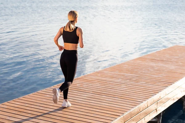 Morning Run Rear View Athletic Blonde Female Jogging Outdoors River — Foto de Stock