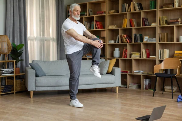 Athletic Senior Man Sportswear Doing Workout Home Stretching His Body —  Fotos de Stock