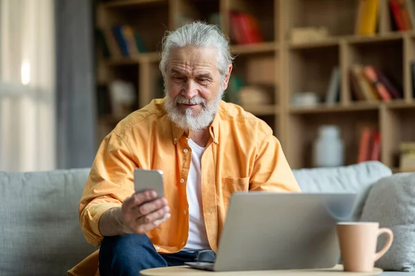Happy Senior Businessman Working Home Sitting Couch Using Modern Laptop — Stok fotoğraf