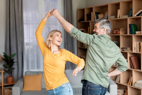 Portrait Positive Middle Aged Couple Dancing Living Room Interior Cheerful — Stockfoto