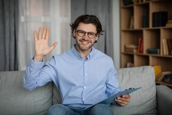 Glad Cheerful Young Caucasian Male Doctor Waving Hand Camera Office — Stockfoto