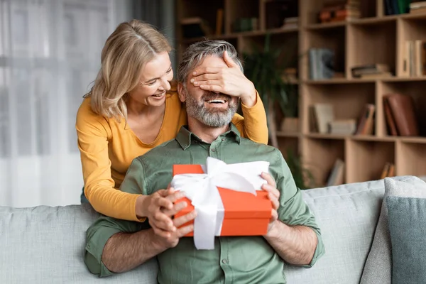 Loving Wife Surprising Middle Aged Husband Present Covering His Eyes — Φωτογραφία Αρχείου
