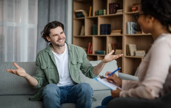 Glad Happy Millennial Caucasian Male Client Meeting Black Woman Psychologist — Stock fotografie