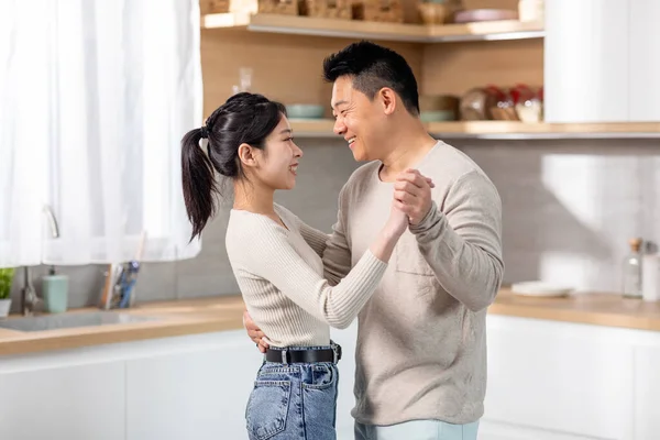 Happily Married Asian Spouses Dancing Waltz Cozy White Kitchen Pretty — Stock fotografie
