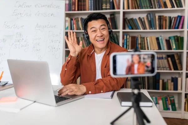 Excited Asian Male Teacher Waving Hello Laptop Computer Teaching Online — ストック写真