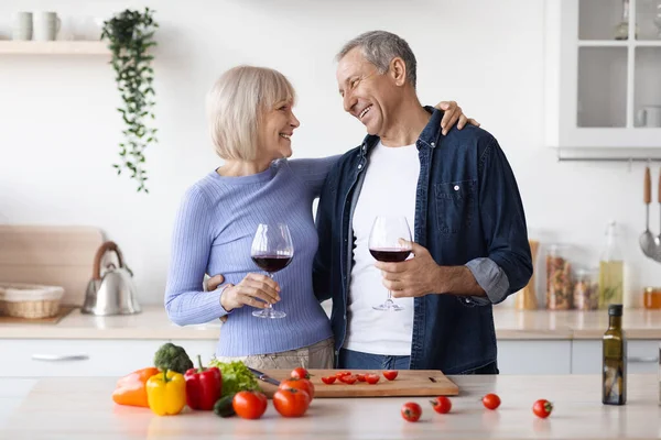 Cheerful Beautiful Senior Man Woman Cooking Healthy Dinner Together Embracing — Stockfoto