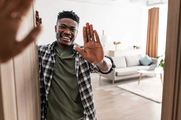 Hello Cheerful Black Man Waving Hand Opening Door His House — Foto Stock
