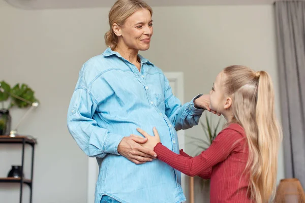 Happy Expectation Concept Little Girl Touching Mothers Pregnant Belly Awaiting — Stockfoto