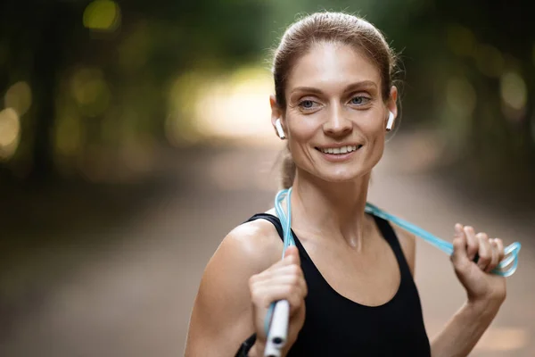 Training Equipment Positive Pretty Blonde Sporty Lady Black Sportswear Exercising — стоковое фото