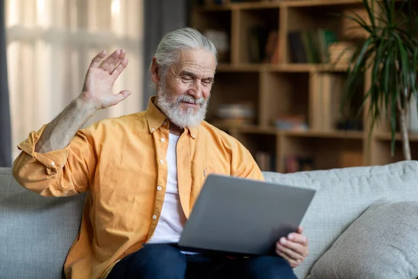 Positive Bearded Senior Man Casual Outfit Sitting Couch Home Having — Stok fotoğraf