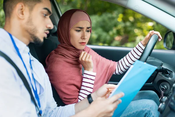 Serious Handsome Young Muslim Man Teacher Shows Pensive Woman Hijab — Stockfoto