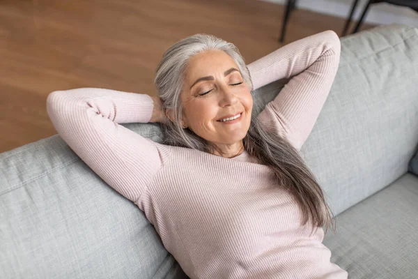 Cheerful Caucasian Senior Gray Haired Lady Closed Eyes Resting Sofa — 图库照片