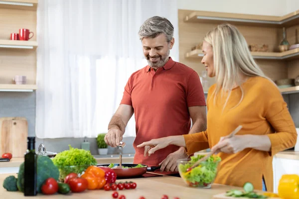 Cheerful Beautiful Family Middle Aged Husband Wife Enjoying Cooking Together — Stockfoto