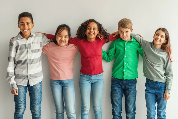 Cheerful Multiethnic Children Hugging Posing Smiling Camera Indoors Preteen Boys — Fotografia de Stock