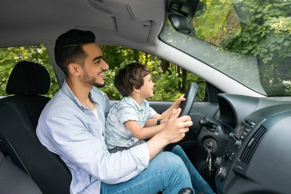 Happy Smiling Muslim Young Male Teaches Small Kid How Drive — Photo