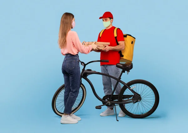 Food Delivery Male Courier Delivering Pizza Boxes Woman Standing Bike — Stok fotoğraf