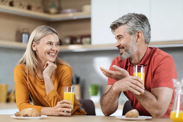 Happy Loving Spouses Having Fun While Eating Kitchen Laughing Gesturing — Foto de Stock