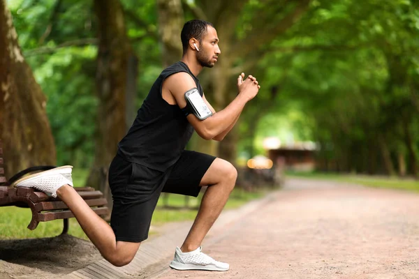 Motivated Handsome Muscular Millennial Black Man Exercising Public Park Squatting — Stock fotografie