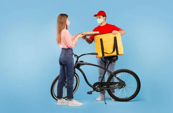 Delivery Service Male Courier Giving Pizza Box Female Wearing Face — Stok fotoğraf