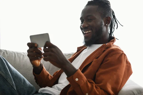 Excited African American Male Gamer Playing Games Smartphone While Chilling —  Fotos de Stock