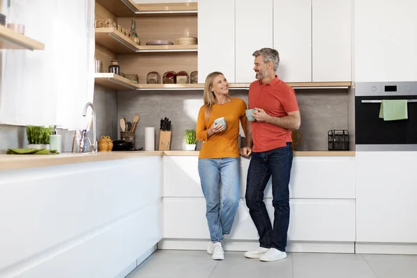 Happy Lovers Middle Aged Attractive Man Woman Standing Kitchen Table — Foto de Stock