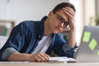 Job Burnout. Depressed Young Manager Looking At Laptop Screen While Working In Office, Tired Male Employee Suffering Lack Of Ideas And Deadline Stress, Having Problems With Creativity, Closeup