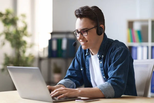 Telecommuting Concept Young Manager Headset Working Laptop Office Smiling Millennial — Fotografia de Stock