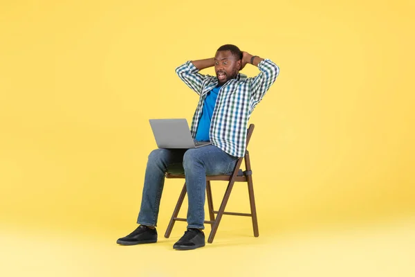 Emotional Black Man Looking Laptop Computer Reading Great Online Offer — стокове фото