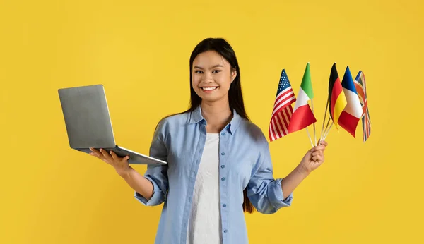 Smiling Young Chinese Female Student Many Different Flags Laptop Isolated — Stock Photo, Image