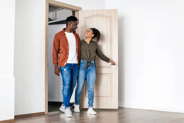 새로운 Happy Black Husband Wife Hugging Entering Own House Posing — 스톡 사진