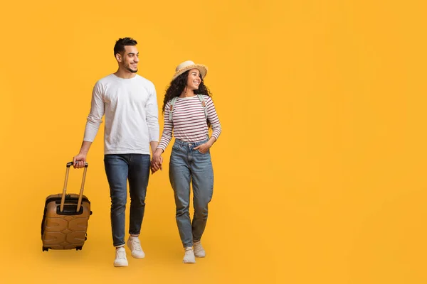 Travel Offer Smiling Arab Couple Walking Suitcase Looking Aside Copy — Stock Photo, Image