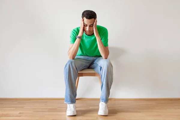 Pensive Young Arab Man Thinking Touching Head Both Hands Sitting — Stock Photo, Image