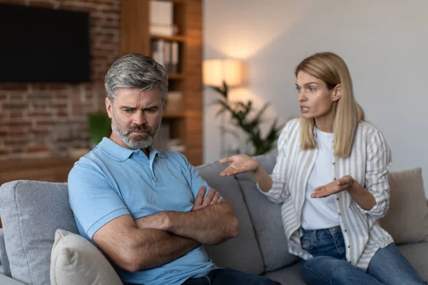 Unhappy Mature Caucasian Wife Scolds Offended Husband Quarreling Sofa Living — Stock Photo, Image