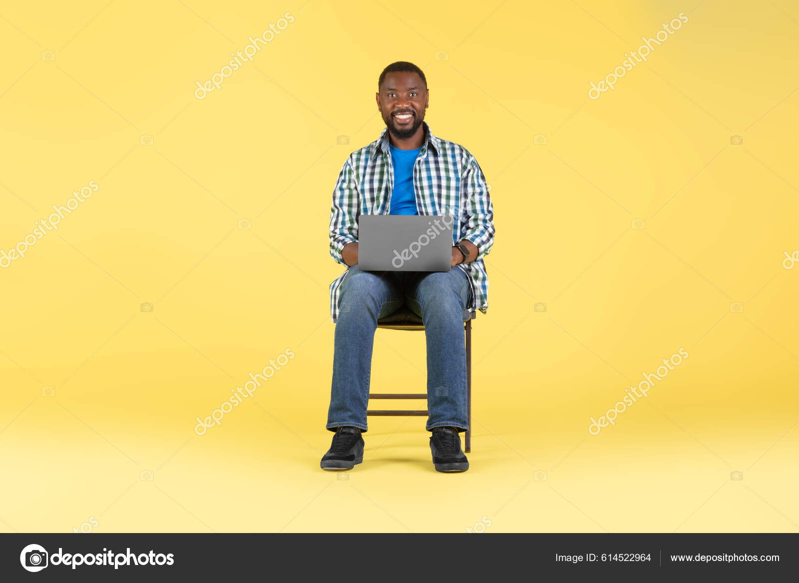 Cheerful Black Man Using Laptop Working Online Advertising